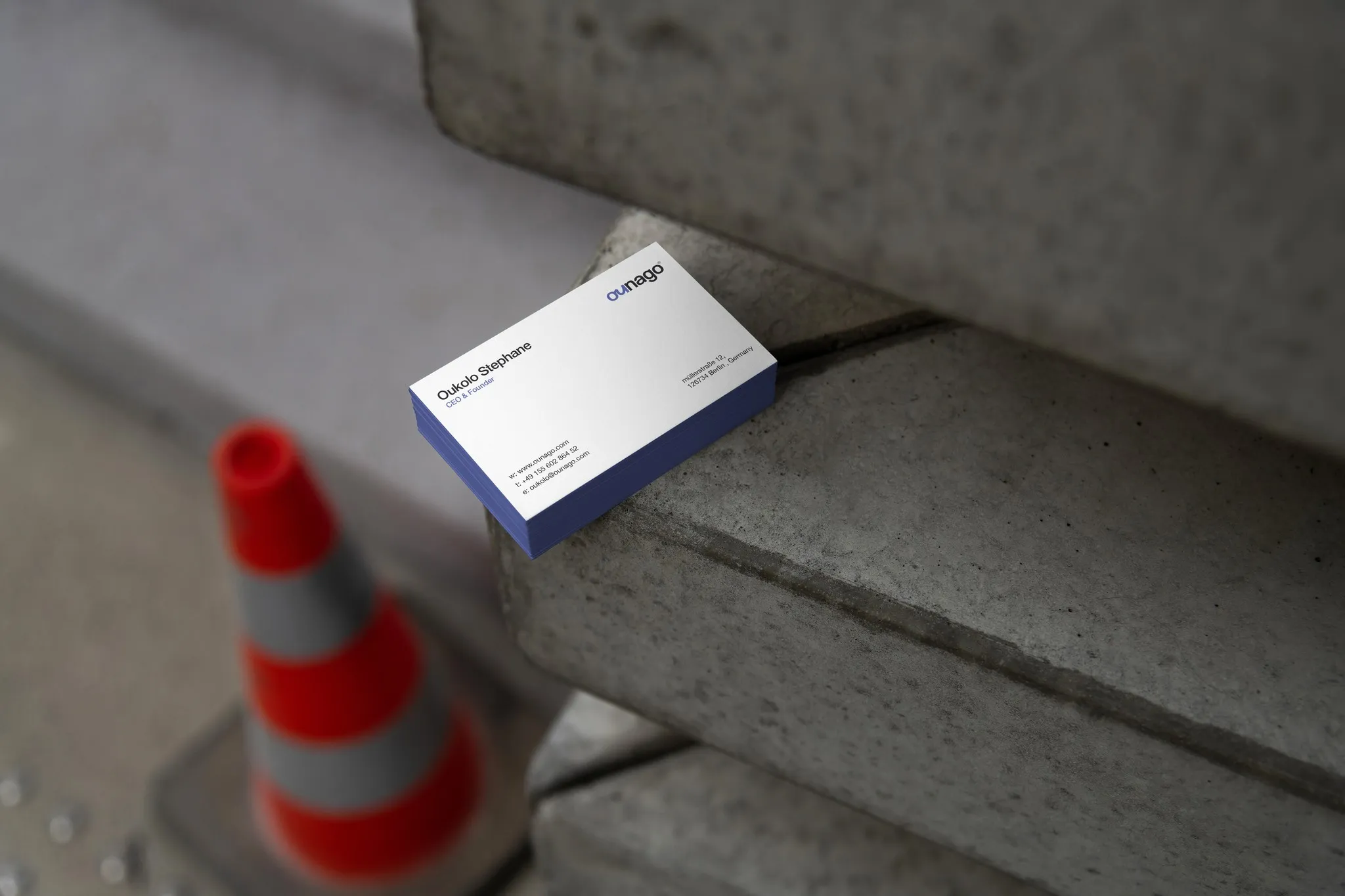 Ounago business card on concrete steps