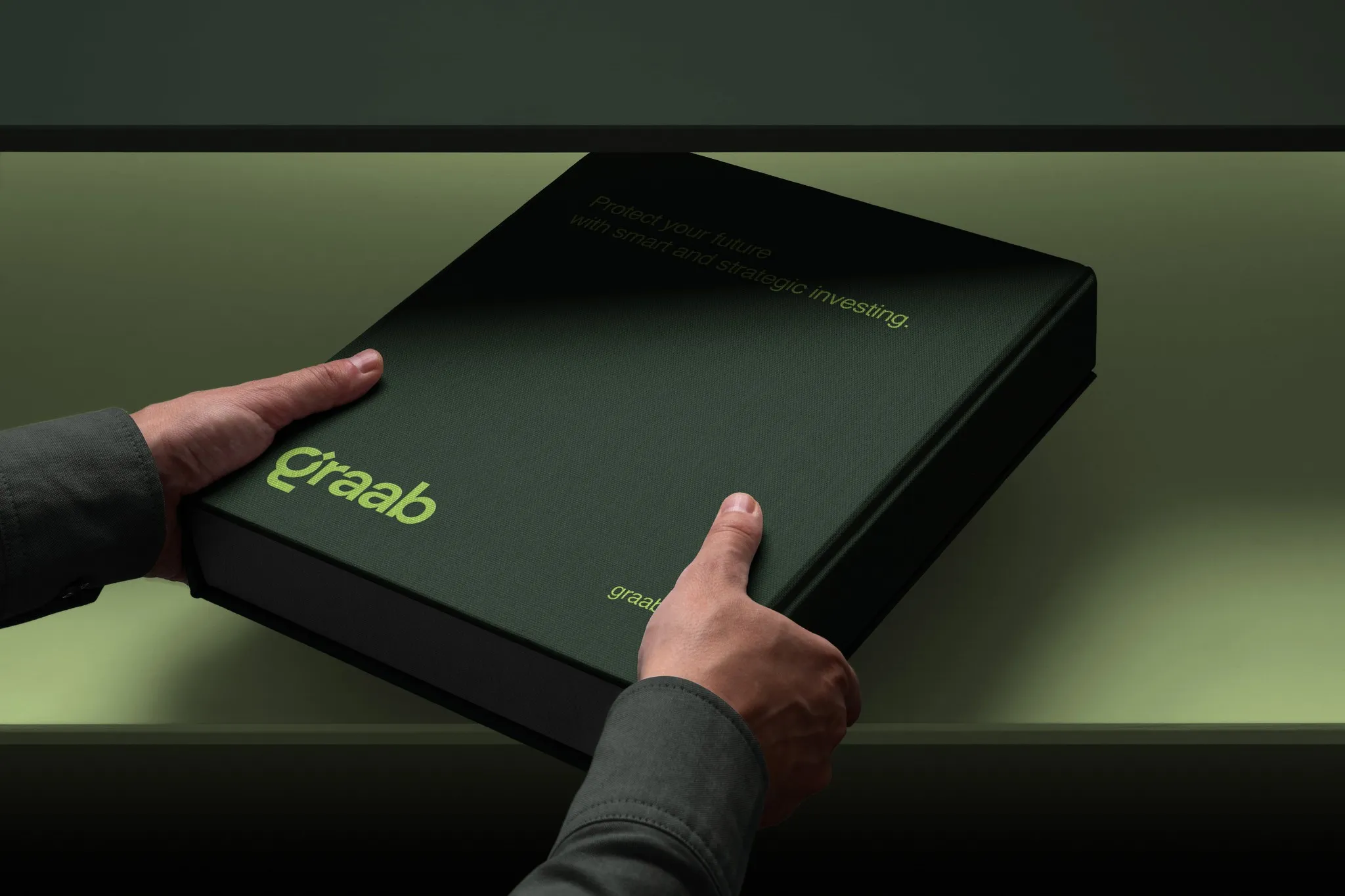 Hands opening a black Graab box