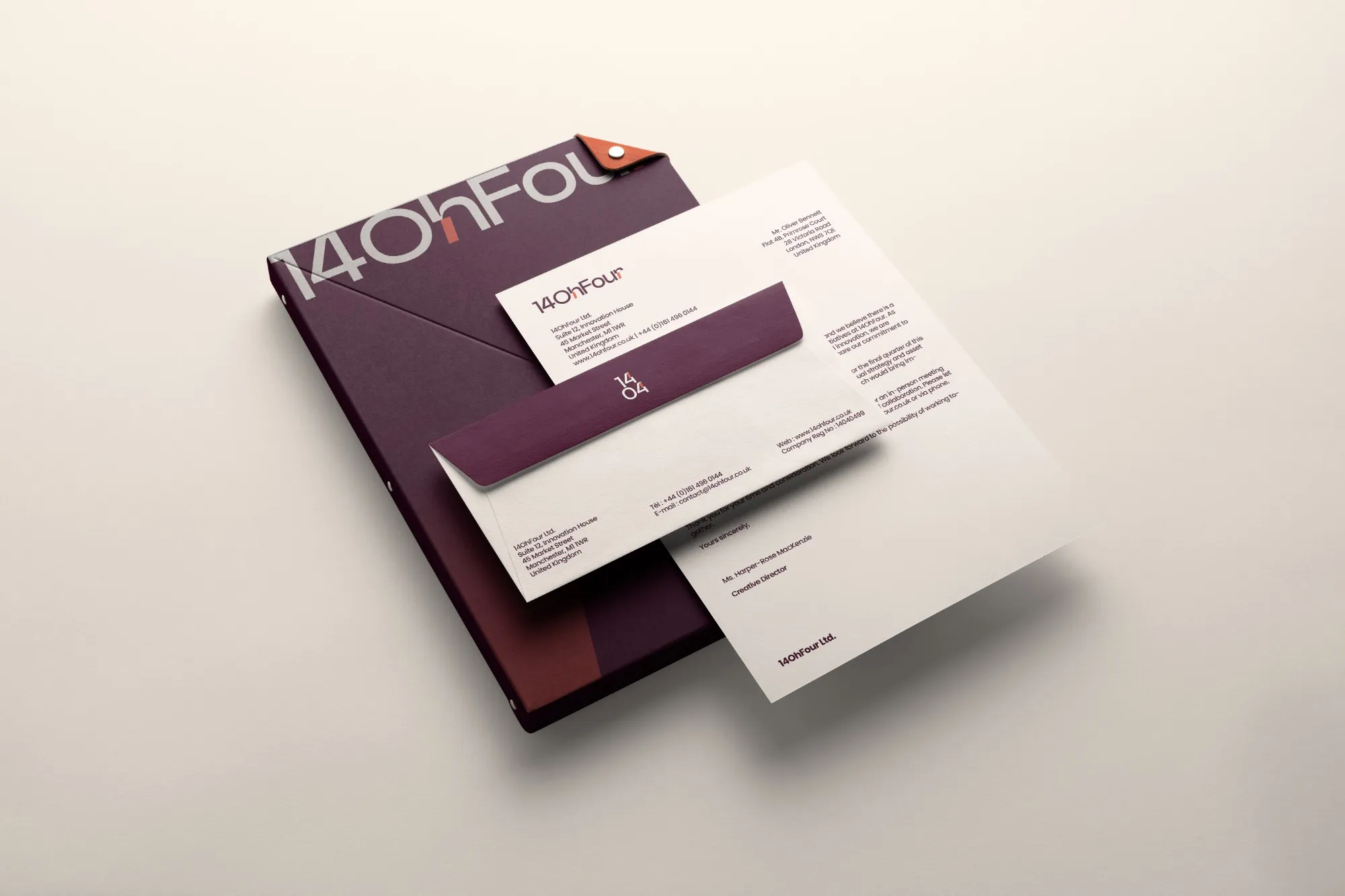 14OhFour stationery: burgundy folder, letterhead and envelope with the compact 14/04 mark