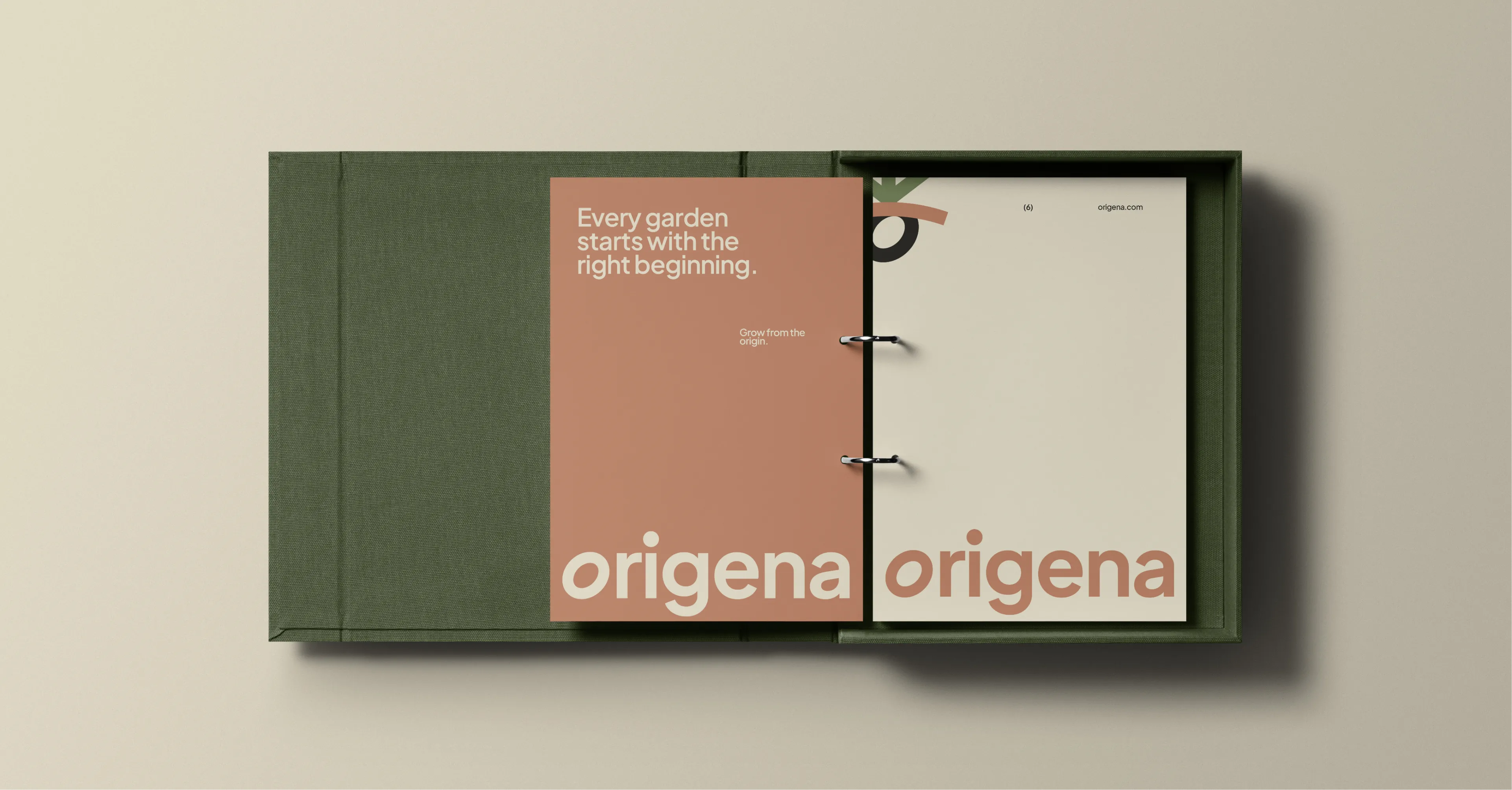 Origena brand guidelines binder in a green linen case